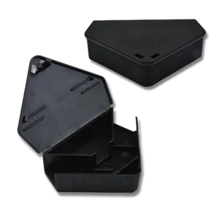 Triangular black plastic mouse bait station by Bainbridge, designed to sit in corners or along walls.