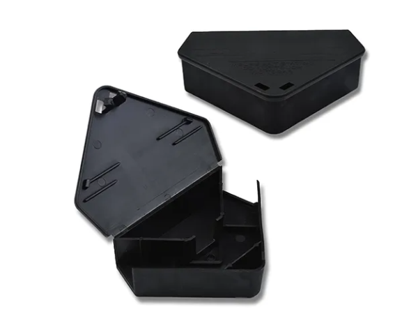 Triangular black plastic mouse bait station by Bainbridge, designed to sit in corners or along walls.
